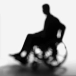 sillouette of man in wheelchair