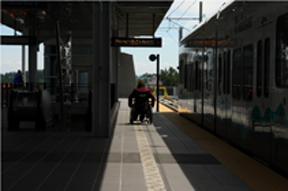 wheelchair user waiting at a Sound Transit station.