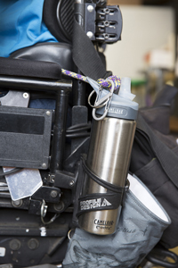 Topeak bottle mount attached to frame on power wheelchair.