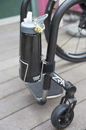 Twofish bottle mount shown attached to wheelchair frame.