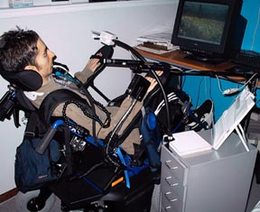 Kees Vanderputton, a computer animator with a C3 spinal cord injury, uses a QuadJoyT (mouth-operated joystick) and voice-recognition software for drawing and navigating the screen.